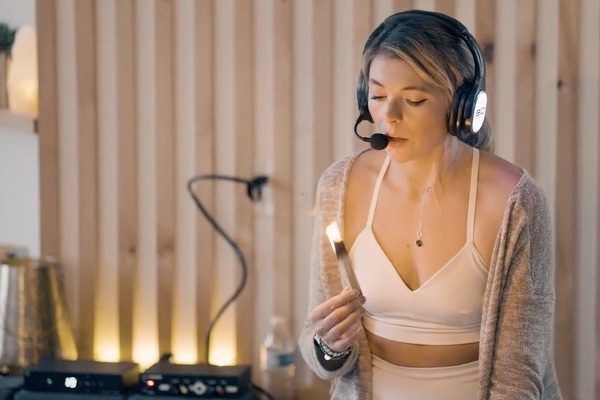 Yoga instructor wearing Sound Off headphones