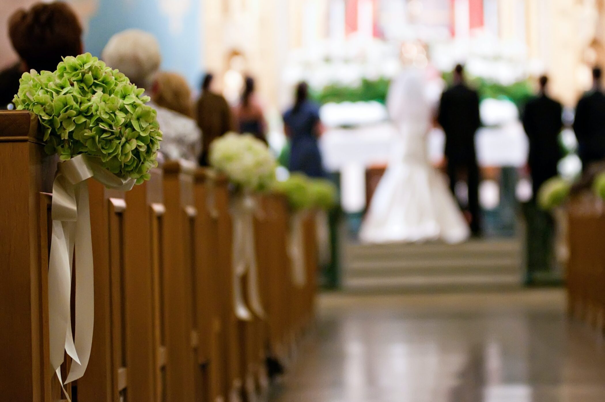 Aisle view of bride and groom at wedding ceremony