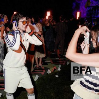 Party goers with silent disco headphones at Gucci party