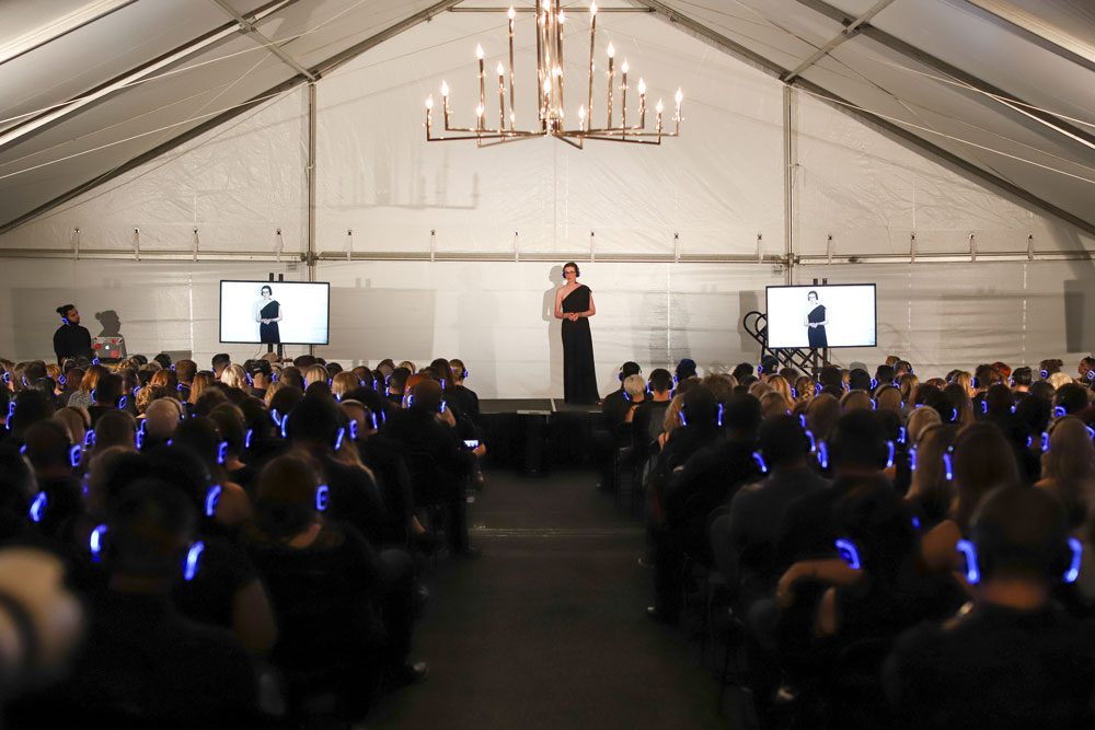 Participants at a conference using silent disco headphones