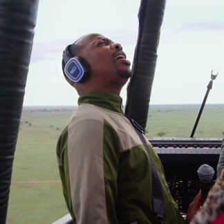 Man wearing silent disco headphones in hot air balloon