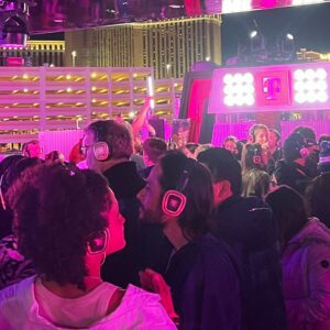 Silent Disco at Formula 1 Las Vegas Audience wearing pink-glowing silent disco headphones at the T Mobile Zone at Formula 1 Las Vegas